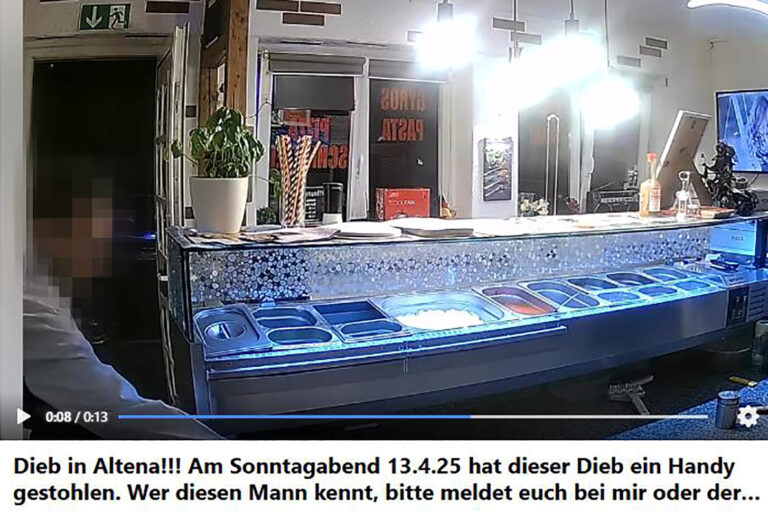 Facebook-Video einer Überwachungskamera, in dem ein Mann ein Handy hinter dem Verkaufstresen einer Pizzeria stiehlt.